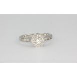 A Jenny Packham 18ct white gold diamond set cluster ring, approx. 0.35ct overall, (M).
