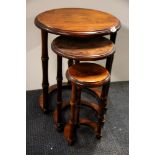 An interesting nest of circular wooden coffee tables, Dia 46cm. H. 58cm.