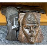 A quantity of African carved hardwood face masks, tallest 47cm.