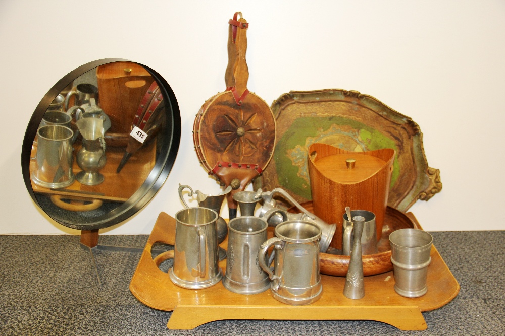 A 1970's circular freestanding mirror together with a group of other items.