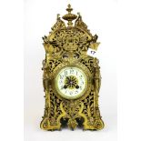 A 19th Century French brass Art Nouveau clock with striking movement and enamelled dial, H. 41.