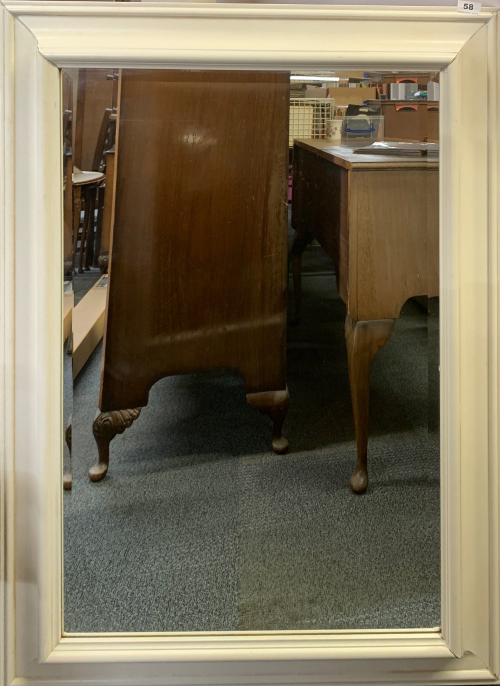 A large framed bevelled glass mirror, 80 x111cm.