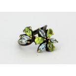 A 925 silver ring set with marquise cut blue topaz and pear cut peridots, (O.5).