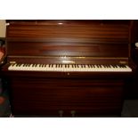 A Chappell upright piano in good playing condition.