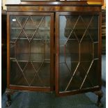 A 1920's mahogany bow front book case display cabinet, W. 120cm. H. 122cm.