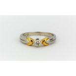 A platinum and 18ct yellow gold brilliant cut diamond set solitaire ring, approx. 0.25ct, (P).