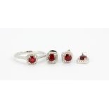 A very pretty 925 silver ring set with ruby and white stones together with matching earrings and