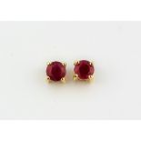 A pair of 14ct yellow gold ruby set stud earrings.