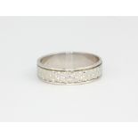 A 9ct white gold wedding band, approx. 2.8gr, (O).