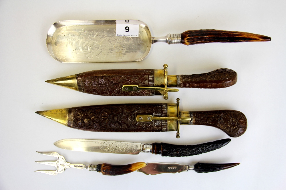 An Eastern brass and wood sheathed carving set together with four items of horn and silver plate.