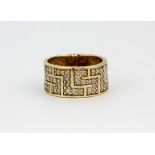 A 9ct yellow gold diamond set Greek pattern ring, approx. 7.9gr, (Q).