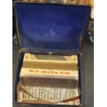 A cased 1930's Pietro piano accordion.