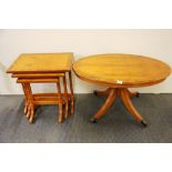 A regency style maple veneered oval coffee table, L. 91cm. Together with a nest of matching coffee