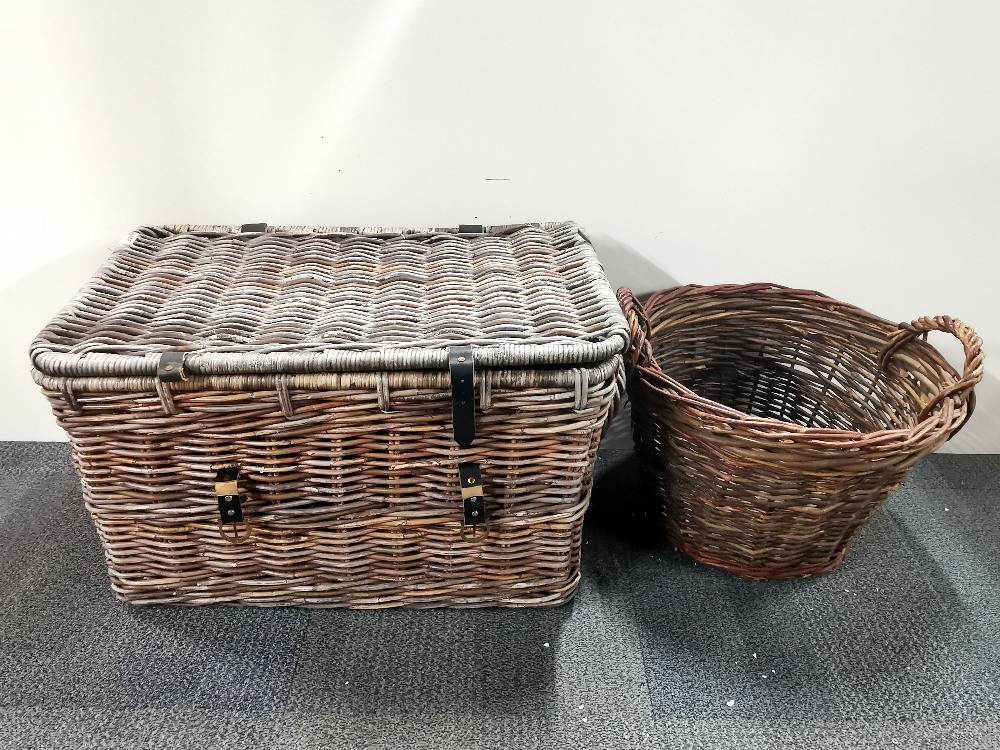 A vintage cane laundry basket, 75 x 46x 46cm. together with a further basket.