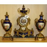 A 19th Century French three piece gilt bronze and porcelain clock garniture, H. 35cm.