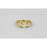 An impressive import hallmarked 18ct yellow gold ring set with a centre brilliant cut and two pear