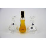 Two Edinburgh Crystal perfume bottles and a French Caprece perfume bottle, H. 11cm.