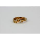 A yellow metal (tested 9ct gold) ring set with an old cut diamond, (Q).