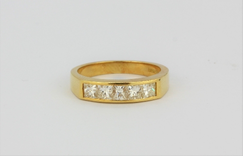 An 18ct yellow gold ring set with four princess cut diamonds, approx. 0.80ct overall, (L.5).
