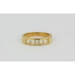 An 18ct yellow gold ring set with four princess cut diamonds, approx. 0.80ct overall, (L.5).