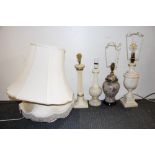 A group of four table lamps and three silk shades.