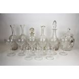 Two cut glass decanters, three cut glass carafe, a set of six cut glass champagne glasses and