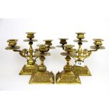 A pair of 19th Century brass candelabra and matching candle sticks. Candelabra H. 19cm. Each with