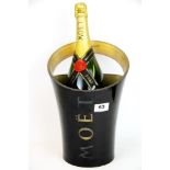 A Moet and Chandon Millennium window display ice bucket and magnum of Champagne, H. 41cm. (window