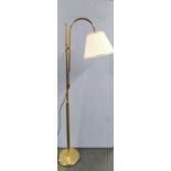 A freestanding gilt brass reading light.