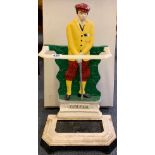 A painted cast iron umbrella stand of 'The Golfer', H. 65cm.