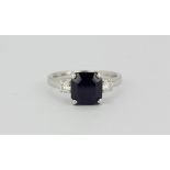 A hallmarked 18ct white gold natural untreated emerald cut sapphire, approx 3.44ct, with diamond set