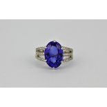 A superb 18ct white gold ring set with 6.5ct AAA quality tanzanite and approximately 0.35ct of