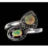 A 925 silver crossover ring set with opals and black spinels, (R).