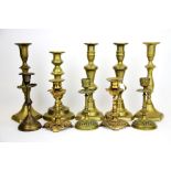 A quantity of 19th Century brass candle sticks, tallest 25cm.