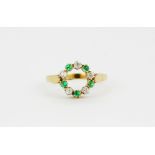 An 18ct yellow gold and platinum emerald and diamond set ring, (Q).