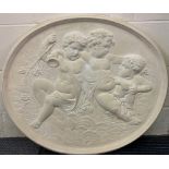 A large waxed plaster Cherub panel, W. 78cm.