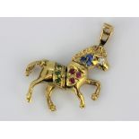 A 9ct yellow gold stone set horse shaped pendant, 3 x 3.5cm.