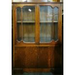 A 1930's oak bookcase, 79 x 114cm.