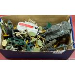 A quantity of die cast models and toy soldiers.