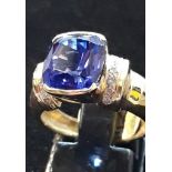 An 14ct yellow gold tanzanite and diamond set ring, approx. over 7ct tanzanite, (N.5).