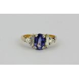 A pretty 18ct yellow gold pale sapphire and diamond cluster ring (stamped 18ct) (K). Oval cut