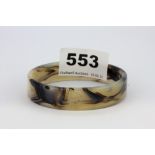 A rare polished banded agate bangle, W. 14mm. Internal Dia. 5.8cm.