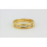 An 18ct yellow gold princess cut diamond set half eternity ring, approx. 0.50ct, (O.5).
