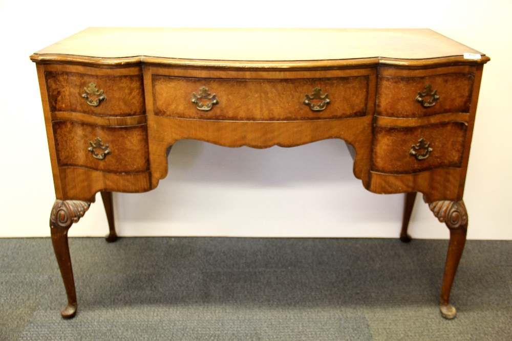 A lovely 1920's walnut veneered dressing table, W. 114cm. H. 77cm.