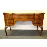 A lovely 1920's walnut veneered dressing table, W. 114cm. H. 77cm.