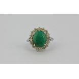 A 14ct (stamped 14ct) emerald and diamond cluster ring. (N.5) Emerald approx 12mm x 10mm. Diamonds