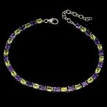 A 925 silver bracelet set with oval cut amethyst and peridots, L. 16cm.