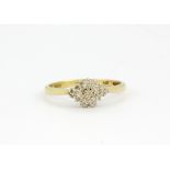 A 9ct yellow gold diamond set cluster ring, (N.5).