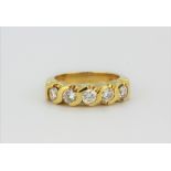 An 18ct yellow gold (stamped 18k) ring set with four brilliant cut diamonds, approx. 0.75ct, (H.5).