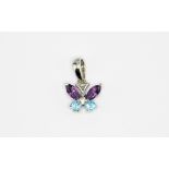 An 18ct white gold butterfly shaped pendant set with amethyst and blue topaz, L. 1.3cm.